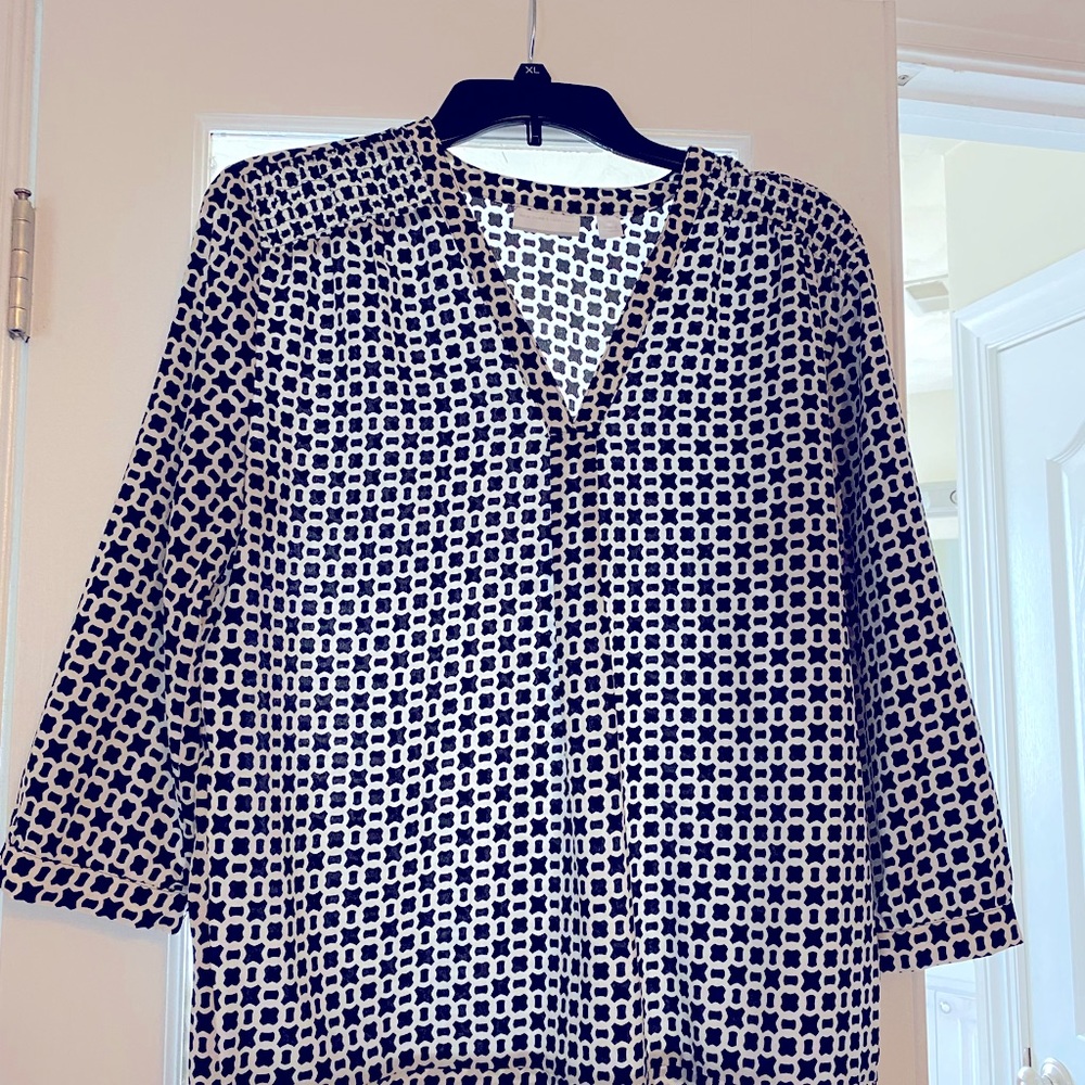 Quarter Sleeve blouse. From office to casual. Deep V neck 100% Polyester.